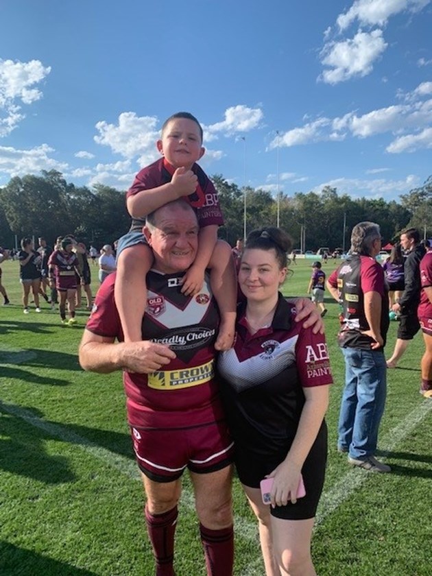 Greg Smith with his daughter Kelly and one of his six grandchildren.