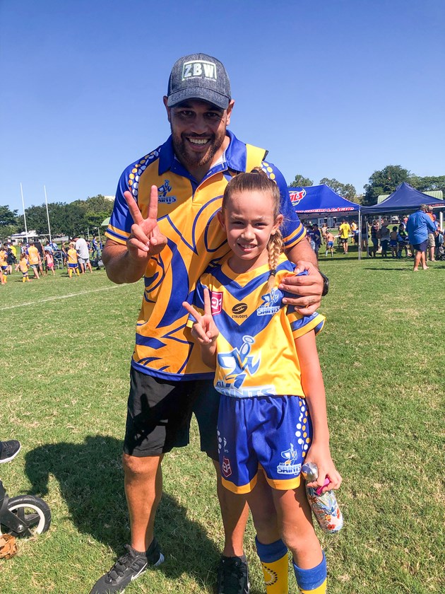Harlan with her father, Antonio, after scoring her first two tries in one game.