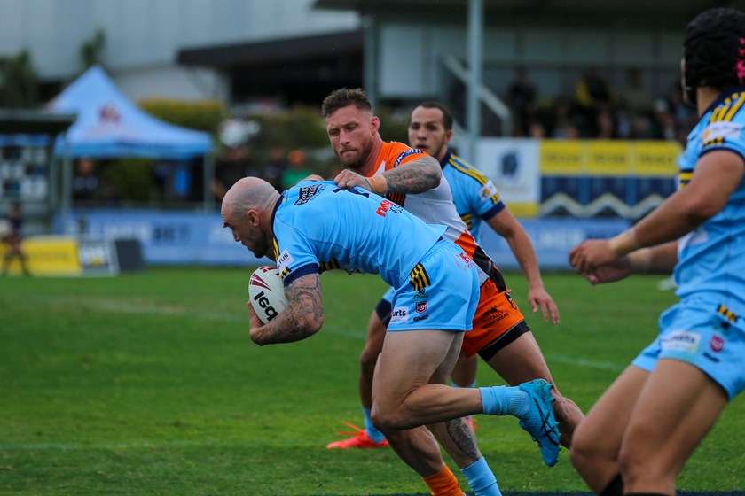 Tariq Sims tackling Jack Ahearn. Photo: Jorja Brinums/QRL