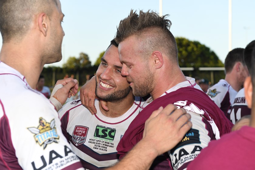 Sam Coster is congratulated by skipper Luke Page. Photo: QRL Media