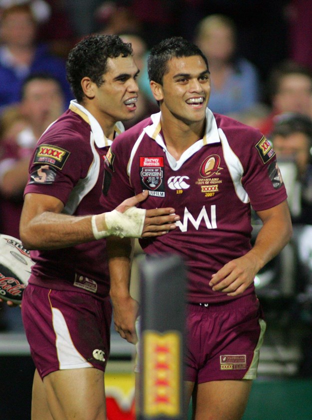 Donning maroon with GI. Photo: NRL Images
