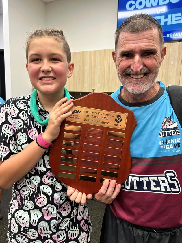 Ryleigh Little and Robert Pethebridge with the shield after Mackay's win