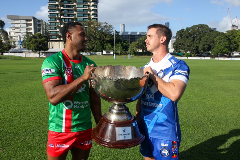 2023 BRL grand final players Wynnum Manly Juniors' Trevor Monaei and Bulimba Bulldogs co-captain Bradley Russell face off with the BRL trophy.