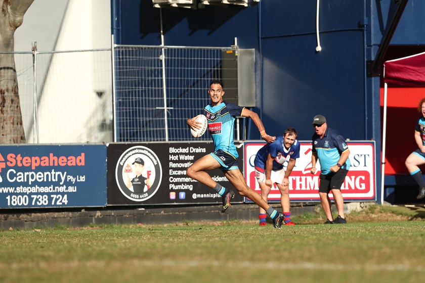 Simon Lyons (background, with hat) cheering on Queille Murray as he raced away to score the winning try in the 2022 XXXX Chairman's Challenge. Photo: Jason O'Brien/QRL