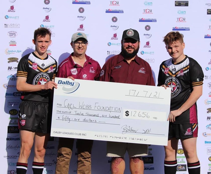 Carl Webb accepting the funds raised by the Dalby Diehards.