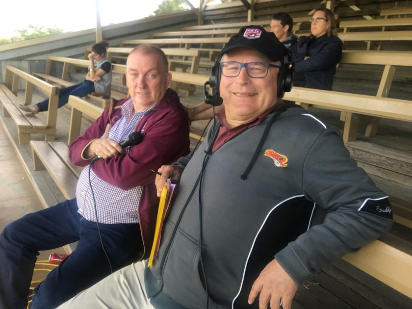 Brad Tallon with QRL Central's Danny McGuire watching a game. 