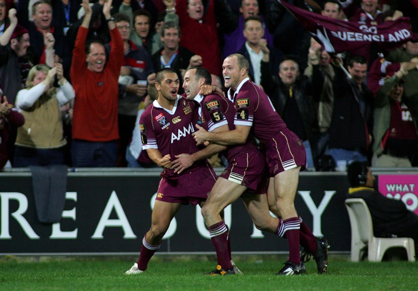 Steven Bell (right), celebrates with Adam Mogg and Karmichael Hunt in State of Origin Game II, 2006.