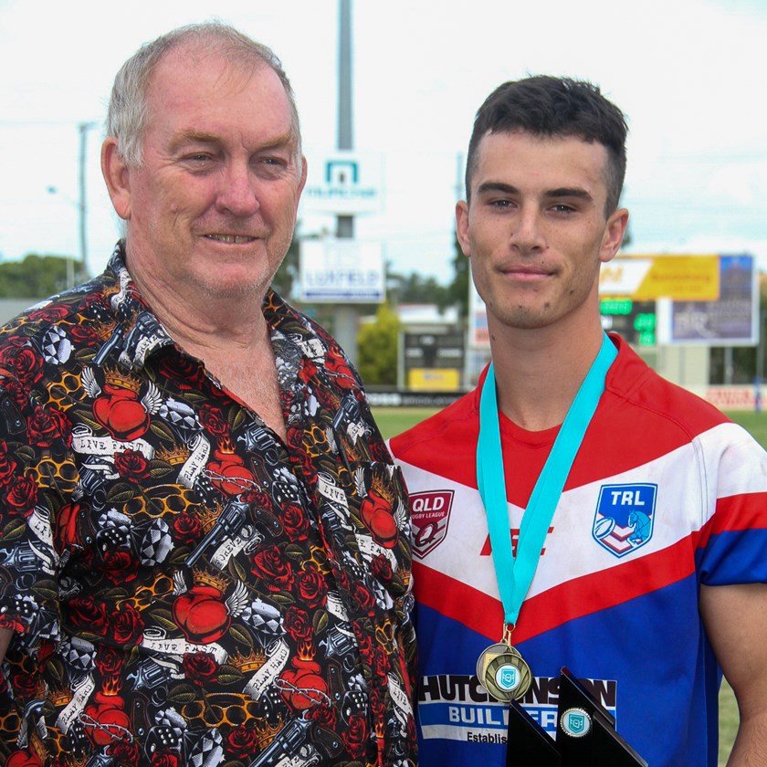 David Armstrong receives the 47th Battalion Men’s player of the carnival award from QRL Central chair Danny McGuire. Photo: Vince Habermann