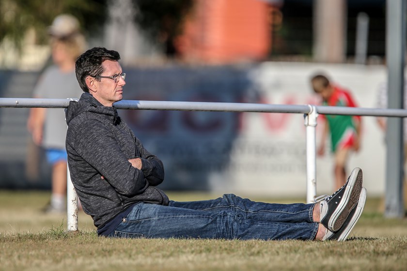 Ben Ikin watches an Intrust Super Cup game during Country Week. Photo: Ritchie Duce QRL Media