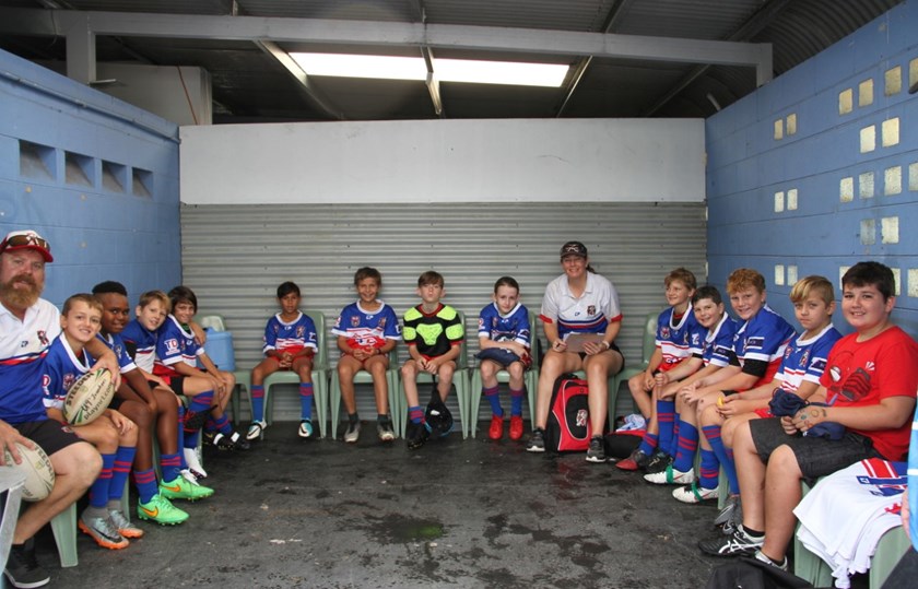 Ivanhoes junior rugby league players and coaches in the dressing room before a game.
