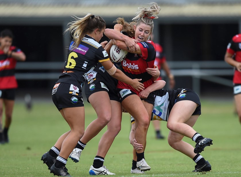 Makenzie Weale is wrapped up by Tweed defenders. Photo: Zain Mohammed / QRL