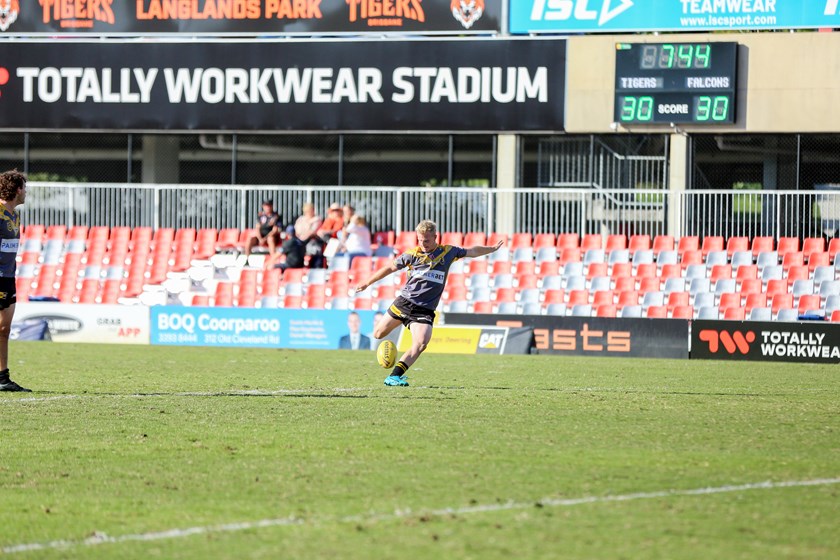 Blake Ginman kicking the winning field goal. Photo: Rikki-Lee Arnold/QRL