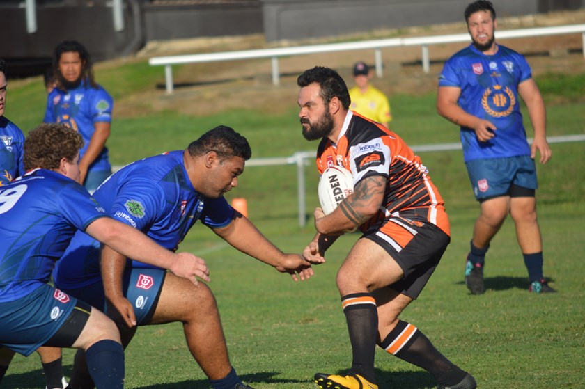 The Tigers charge into the Eagleby defence. Photo: Mike Simpson 