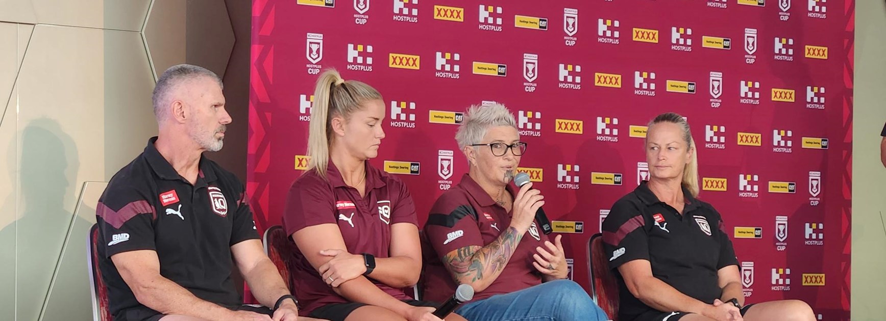 Ward (second from the left) on stage at the Future Maroons Coaching Conference with QRL physical performance manager John Mitchell, wellbeing officer Carmen Taplin, and Harvey Norman Queensland Maroons coach, Tahnee Norris.