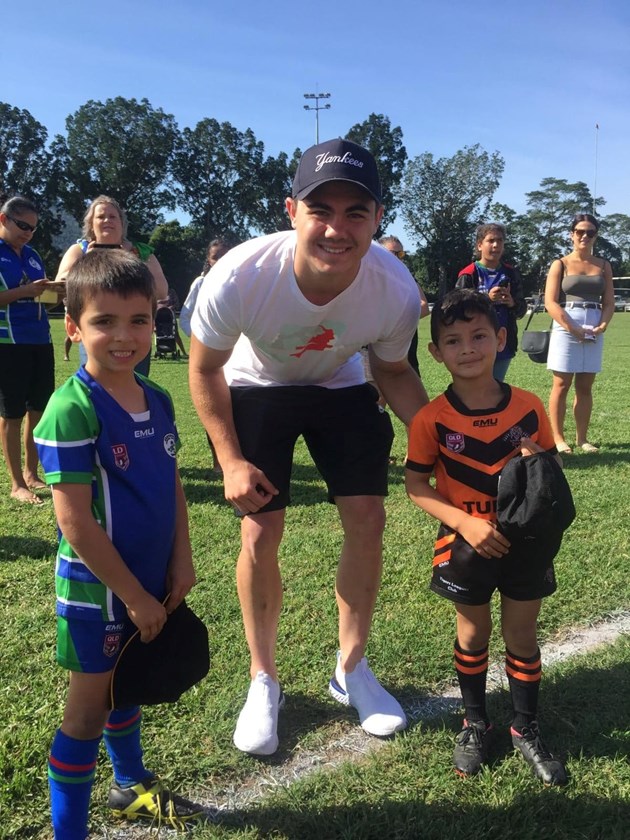Jake Clifford stopped in to watch Tully Tigers junior rugby league games where it all began for him and presented Best and Fairest Awards to Under 6s players Rick from Innisfail Brothers and William from Tully Tigers. Photo: Tully Junior Rugby League 