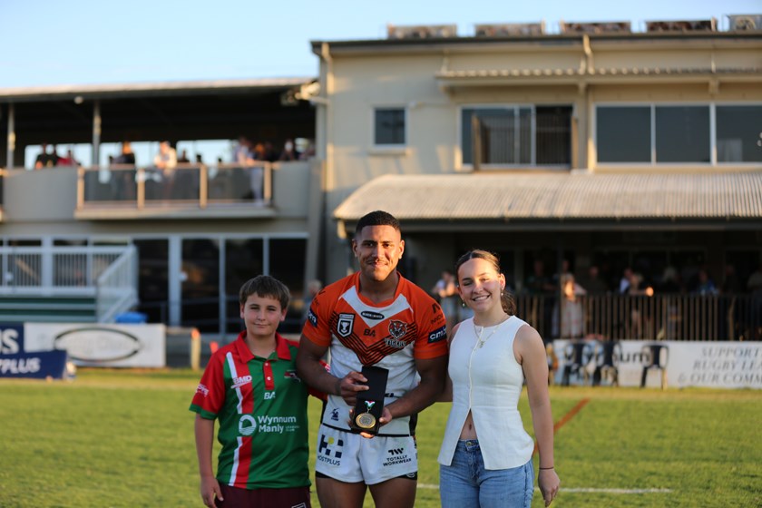 Philitoga with the Paul Green Medal and Green's children, Jed and Emerson.