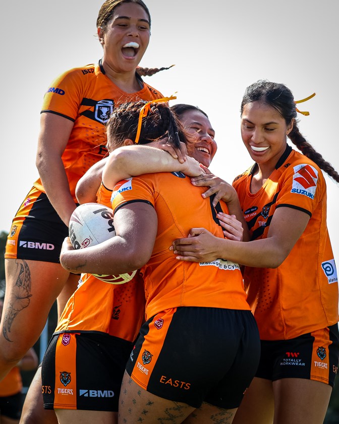 The Brisbane Tigers a celebrate an unbeaten season. 