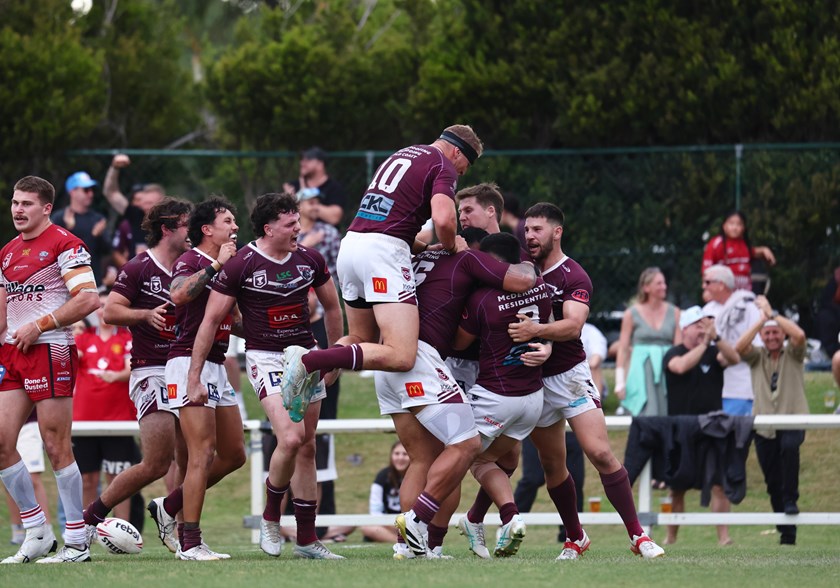 The Burleigh Bears celebrate a win over the Redcliffe Dolphins.