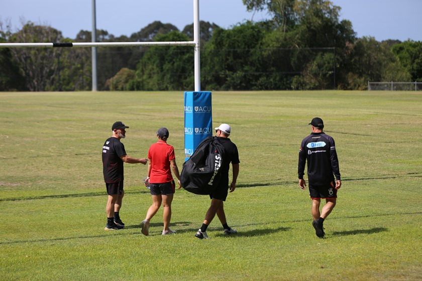 Coaches prepare for an on-field session. 