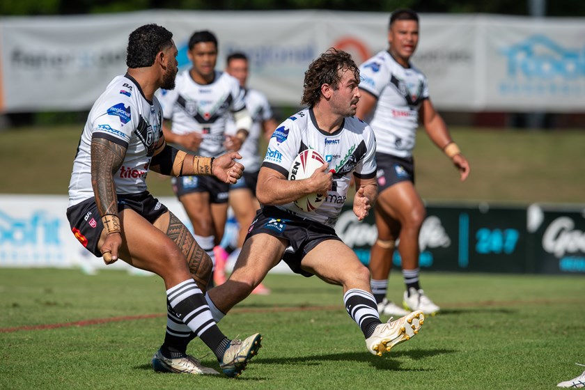 Magpies captain Rory Ferguson takes a carry.