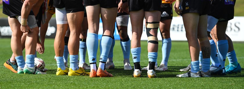 Blue socks are worn by both teams to support Turn to Me round